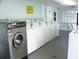 Clean and spacious laundry room with multiple modern washing machines at 34071 Avocado N Dr, Pinellas Park, FL 33781