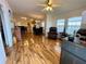 Spacious living room with hardwood floors and access to kitchen at 34071 Avocado N Dr, Pinellas Park, FL 33781
