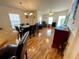 Open living area with wood floors and natural light from large windows at 34071 Avocado N Dr, Pinellas Park, FL 33781