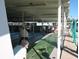 A covered shuffleboard court where residents can play shuffleboard at 34071 Avocado N Dr, Pinellas Park, FL 33781