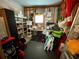 Organized garage storage area with shelving, work table, and various supplies at 34071 Avocado N Dr, Pinellas Park, FL 33781
