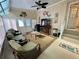 Cozy sunroom with comfortable furniture, ceiling fan and natural light at 34071 Avocado N Dr, Pinellas Park, FL 33781