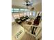 Bright sunroom with tile flooring, comfortable seating, and plenty of natural light at 34071 Avocado N Dr, Pinellas Park, FL 33781