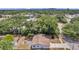 Aerial view of a single-story house with a spacious backyard and surrounding trees at 3445 10Th N Ave, St Petersburg, FL 33713