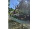 View of backyard with overgrown vegetation and utility truck at 3445 10Th N Ave, St Petersburg, FL 33713