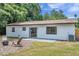 Newly renovated home with a patio, fire pit, and lush lawn at 3445 10Th N Ave, St Petersburg, FL 33713