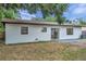 Backyard of a newly renovated home featuring a patio and lush greenery at 3445 10Th N Ave, St Petersburg, FL 33713