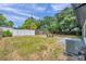 Large backyard with grassy area, fire pit, and AC unit at 3445 10Th N Ave, St Petersburg, FL 33713