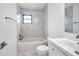 Updated bathroom with white vanity, marble tile, and bathtub at 3445 10Th N Ave, St Petersburg, FL 33713