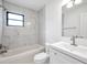 Modern bathroom featuring marble shower and white fixtures at 3445 10Th N Ave, St Petersburg, FL 33713