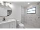 Updated bathroom with white vanity, marble shower, and modern fixtures at 3445 10Th N Ave, St Petersburg, FL 33713