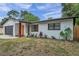 Updated Ranch home with modern garage door and landscaping at 3445 10Th N Ave, St Petersburg, FL 33713