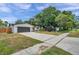 House exterior boasts a modern garage door and freshly painted white walls at 3445 10Th N Ave, St Petersburg, FL 33713