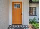 Inviting front door with a vibrant orange color and patterned tile at 3445 10Th N Ave, St Petersburg, FL 33713