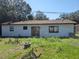 White single story home with black trim and grassy backyard at 3445 10Th N Ave, St Petersburg, FL 33713