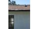 Rear view of a single story home with white walls and black windows at 3445 10Th N Ave, St Petersburg, FL 33713