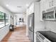 Open concept kitchen with stainless steel appliances and white cabinets at 3445 10Th N Ave, St Petersburg, FL 33713