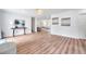 Light and airy living room with hardwood floors and view into the kitchen at 3445 10Th N Ave, St Petersburg, FL 33713