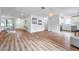 Open concept living area showcasing hardwood floors and kitchen at 3445 10Th N Ave, St Petersburg, FL 33713