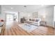 Living room features light wood floors and an off-white sofa at 3445 10Th N Ave, St Petersburg, FL 33713