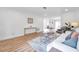 Bright living room with light hardwood floors, comfy seating, and a stylish coffee table at 3445 10Th N Ave, St Petersburg, FL 33713