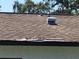 Image shows a damaged roof with missing shingles at 3445 10Th N Ave, St Petersburg, FL 33713