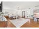 Large main bedroom with hardwood floors, a plush bed, and an ensuite bathroom at 425 20Th Ne Ave, St Petersburg, FL 33704