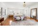 Main bedroom with hardwood floors and a cozy sitting area at 425 20Th Ne Ave, St Petersburg, FL 33704