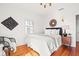 Serene bedroom with hardwood floors, window shutters, and tasteful wall art at 425 20Th Ne Ave, St Petersburg, FL 33704