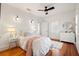 Bright bedroom with hardwood floors, white walls and window shutters at 425 20Th Ne Ave, St Petersburg, FL 33704