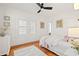 Bright bedroom with hardwood floors, white walls, and a queen bed at 425 20Th Ne Ave, St Petersburg, FL 33704