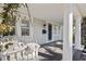 Inviting front porch with a white swing and a view of the front yard at 425 20Th Ne Ave, St Petersburg, FL 33704
