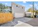 House with attached garage and wooden fence in residential neighborhood at 425 20Th Ne Ave, St Petersburg, FL 33704