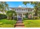 Two-story house with manicured lawn and brick walkway at 425 20Th Ne Ave, St Petersburg, FL 33704