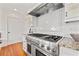 Stainless steel range, granite counters, and white shaker cabinets highlight this kitchen at 425 20Th Ne Ave, St Petersburg, FL 33704