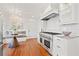 Modern kitchen with high-end stainless steel range and white cabinetry at 425 20Th Ne Ave, St Petersburg, FL 33704