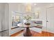 Charming breakfast nook with window seating and a round wooden table at 425 20Th Ne Ave, St Petersburg, FL 33704