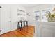 Bright laundry room with white washer and dryer and wood floors at 425 20Th Ne Ave, St Petersburg, FL 33704