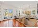 Spacious living area with hardwood floors, large windows, and access to a back deck at 425 20Th Ne Ave, St Petersburg, FL 33704