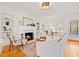 Cozy living room featuring a fireplace, built-in shelves and hardwood floors at 425 20Th Ne Ave, St Petersburg, FL 33704
