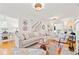 Open living room with hardwood floors, a fireplace, and ample natural light at 425 20Th Ne Ave, St Petersburg, FL 33704