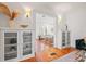 Open living area with built-in shelving and hardwood floors at 425 20Th Ne Ave, St Petersburg, FL 33704