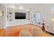 Living room with built-in shelving and hardwood floors at 425 20Th Ne Ave, St Petersburg, FL 33704