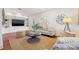 Relaxing living room with built-in shelving and a large TV at 425 20Th Ne Ave, St Petersburg, FL 33704