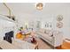 Bright living room features hardwood floors, comfy seating, and a fireplace at 425 20Th Ne Ave, St Petersburg, FL 33704