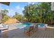 Relaxing pool and spa area with wooden deck and lounge chairs at 425 20Th Ne Ave, St Petersburg, FL 33704