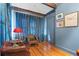 Sitting room with blue walls, hardwood floors, and leather chairs at 425 20Th Ne Ave, St Petersburg, FL 33704