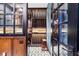 Walk-in wine cellar with wooden racks and hexagonal tile floor at 425 20Th Ne Ave, St Petersburg, FL 33704