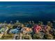 Aerial view of waterfront homes with private docks and lush landscaping at 4419 Bayshore Ne Blvd, St Petersburg, FL 33703