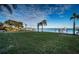 Landscaped backyard with lush green grass and waterfront access at 4419 Bayshore Ne Blvd, St Petersburg, FL 33703